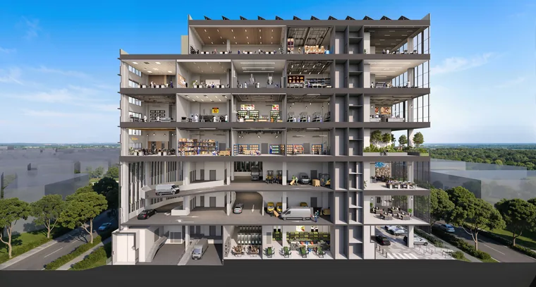 Space Nova cross-section illustration — ramp-up carpark and loading decks on the lower storeys with clean industrial units, offices and the sky terrace above