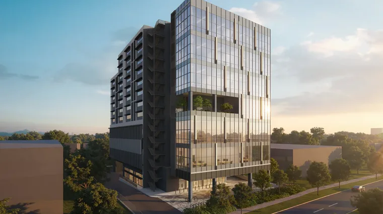 Space Nova freehold B1 industrial at 21 New Industrial Road — sunset side view showing the glass curtain wall and sky terrace